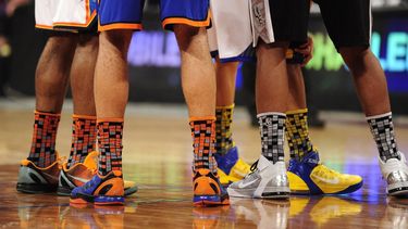 Players wear colorful socks during the NBA All Star - Rookie Challenge at the Staples Center in Los Angeles February 18, 2011.  The Rookies won 148-140.  AFP PHOTO / Robyn Beck 
Robyn BECK / AFP