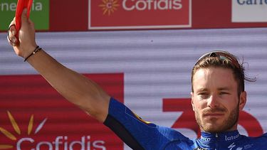 2021-08-27 18:28:43 Team Deceuninck's French rider Florian Senechal celebrates on the podium after winning the 13th stage of the 2021 La Vuelta cycling tour of Spain, a 203.7 km race from Belmez to Villanueva de la Serena, on August 27, 2021. 
JORGE GUERRERO / AFP