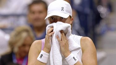 Poland's Iga Swiatek sits between games as she plays against USA's Jessica Pegula during their women's quarterfinals match on day ten of the US Open tennis tournament at the USTA Billie Jean King National Tennis Center in New York City, on September 4, 2024. 
Kena Betancur / AFP