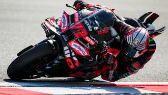 Aprilia Racing team's Italian MotoGP rider Marco Bezzecchi drives during the practice session of motorcycle Austrian Moto GP Grand Prix at the Red Bull ring circuit in Spielberg, Austria, on August 15, 2025.  
Jure Makovec / AFP