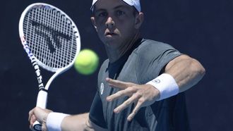 epa11080764 Tallon Griekspoor of the Netherlands in action against Roman Safiullin of Russia during the Women's 1st round match at the Australian Open tennis tournament in Melbourne, Australia, 16 January 2024.  EPA/MAST IRHAM