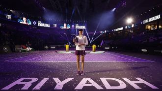 epa12512634 Elena Rybakina of Kazakhstan poses with her trophy after winning the 2025 WTA Finals final match against Aryna Sabalenka of Belarus in Riyadh, Saudi Arabia, 08 November 2025.  EPA/STRINGER