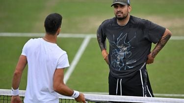 Serbia's Novak Djokovic takes part in a training session with Australia's Nick Kyrgios on the Aorangi practice courts on the eleventh day of the 2024 Wimbledon Championships at The All England Lawn Tennis and Croquet Club in Wimbledon, southwest London, on July 11, 2024. 
ANDREJ ISAKOVIC / AFP