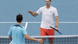 Poland’s Hubert Hurkacz (R) is congratulated by Kazakhstan's Alexander Shevchenko after his victory in their men’s semi-final match at the United Cup tennis tournament on Ken Rosewall Arena in Sydney on January 4, 2025. 
Steve CHRISTO / AFP