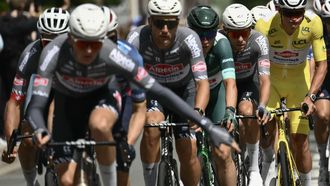 Alpecin - Deceuninck team's Dutch rider Mathieu van der Poel wearing the overall leader's yellow jersey (R) cycles with Alpecin - Deceuninck team's Belgian rider Jasper Philipsen wearing the best sprinter's green jersey (3rd R) and teammates during the 3rd stage of the 112th edition of the Tour de France cycling race, 178.3 km between Valenciennes and Dunkerque (Dunkirk), Northern France, on July 7, 2025. 
Marco BERTORELLO / AFP