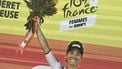 AG Insurance - Soudal Team's Mauritius rider Kimberley Le Court Pienaar celebrates on the podium after winning the 5th stage (out of 9) of the fourth edition of the Women's Tour de France cycling race, 165.8 km from Chasseneuil-du-Poitou to Gueret, in Gueret, central France on July 30, 2025. 
JULIEN DE ROSA / AFP
