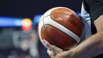 epa12333472 A referee holds the basketball ball during the EuroBasket 2025 group phase basketball match between Turkiye and Czech Republic, in Riga, Latvia, 29 August 2025.  EPA/TOMS KALNINS