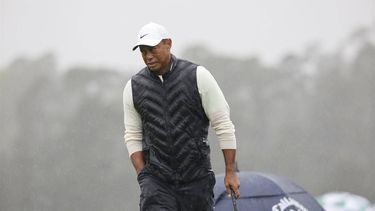 epa10564743 Tiger Woods of The United States on the 18th green in the second round of the Masters Tournament at the Augusta National Golf Club in Augusta, Georgia, USA, 08 April 2023. Play was suspended due to weather and resumed 08 April 2023.  EPA/ERIK S. LESSER