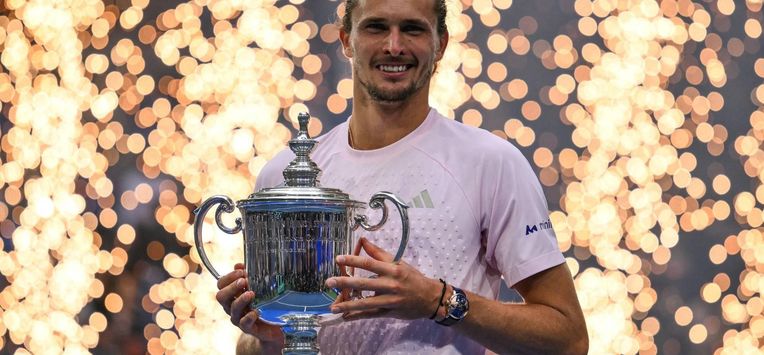 Germany's Alexander Zverev holds the trophy after defeating USA's Ben Shelton in the men's singles final tennis match on day fifteen of the US Open tennis tournament at the USTA Billie Jean King National Tennis Center in New York on September 13, 2026. 
ANGELA WEISS / AFP