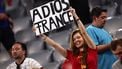 epa11469387 A supporter of Spain holds a placard reading 'Adios France' after winning the UEFA EURO 2024 semi-finals soccer match between Spain and France in Munich, Germany, 09 July 2024.  EPA/ANNA SZILAGYI