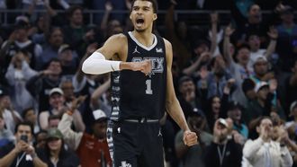 epa11227329 San Antonio Spurs center Victor Wembanyama of France (R) reacts after defeating  the Brooklyn Nets in overtime in Austin, Texas, USA, 17 March 2024.  EPA/ADAM DAVIS SHUTTERSTOCK OUT