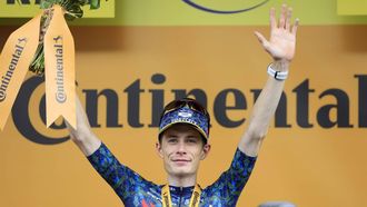 epa11470367 Danish rider Jonas Vingegaard of Team Visma Lease a Bike celebrates on the podium after winning the eleventh stage of the 2024 Tour de France cycling race over 211km from Evaux-les-Bains to Le Lioran, France, 10 July 2024.  EPA/GUILLAUME HORCAJUELO