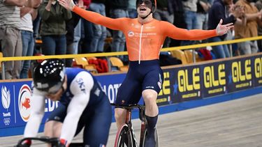 First placed Netherlands' Harrie Lavreysen (C) celebrates winning gold in the final round of the Men's Keirin race during the fifth day of the UEC European Track Cycling Championships at the Omnisport indoor arena in Apeldoorn, on January 14, 2024. 
JOHN THYS / AFP