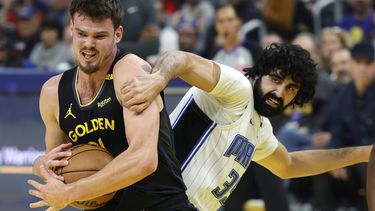 epa11873815 Golden State Warriors center Quinten Post (L) grabs a rebound away from Orlando Magic center Goga Bitadze (R) during the first half of the NBA game between the Orlando Magic and the Golden State Warriors in San Francisco, California, USA, 03 February 2025.  EPA/JOHN G. MABANGLO SHUTTERSTOCK OUT