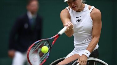 Netherlands' Diede De Groot returns against Netherlands' Aniek Van Koot during their women's wheelchair singles final tennis match on the thirteens day of the 2024 Wimbledon Championships at The All England Lawn Tennis and Croquet Club in Wimbledon, southwest London, on July 13, 2024. 
HENRY NICHOLLS / AFP