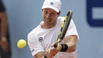 epa11481718 Botic van de Zandschulp of Netherland in action against Dominic Stricker of Switzerland at the Swiss Open tennis tournament in Gstaad, Switzerland, 16 July 2024.  EPA/PETER SCHNEIDER
