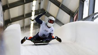 epa11774484 Winner Kimberley Bos of Netherlands crosses the finish line during the women's Skeleton race at the IBSF Bob & Skeleton World Cup in Sigulda, Latvia, 13 December 2024.  EPA/TOMS KALNINS