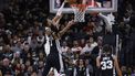 epa11057853 Milwaukee Bucks forward Giannis Antetokounmpo of Greece dunks past San Antonio Spurs center Victor Wembanyama of France during the second half of an NBA game against the Milwaukee Bucks in San Antonio, Texas, USA, 04 January 2024.  EPA/ADAM DAVIS SHUTTERSTOCK OUT