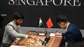 China’s chess grandmaster Ding Liren (R) and India’s chess grandmaster Gukesh Dommaraju (L) compete during the start of the FIDE World Chess Championship in Singapore on November 25, 2024. 
Roslan RAHMAN / AFP