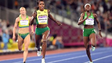 Jamaica's Elaine Thompson-Herah (C) competes to win and take the gold medal and set a new Commonwealth record in the women's 200m final athletics event at the Alexander Stadium, on day nine of the Commonwealth Games in Birmingham, central England, on August 6, 2022. 
Glyn KIRK / AFP