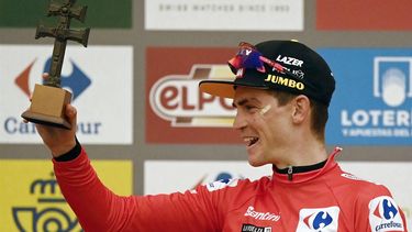 2023-09-03 17:55:53 Team Jumbo-Visma's US rider Sepp Kuss celebrates on the podium retaining the overall leader's red jersey after the stage 9 of the 2023 La Vuelta cycling tour of Spain, a 184,5 km hilly race from Cartagena to Collado de la Cruz de Caravaca, on September 3, 2023. 
JOSE JORDAN / AFP