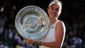 Czech Republic's Linda Noskova poses with the winner's trophy, the Venus Rosewater Dish, after winning against Czech Republic's Karolina Muchova during their women's singles final tennis match on the thirteenth day of the 2026 Wimbledon Championships at The All England Lawn Tennis and Croquet Club in Wimbledon, southwest London, on July 11, 2026. 
Adrian Dennis / AFP