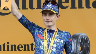 epa11470406 Danish rider Jonas Vingegaard of Team Visma Lease a Bike celebrates on the podium after winning the eleventh stage of the 2024 Tour de France cycling race over 211km from Evaux-les-Bains to Le Lioran, France, 10 July 2024.  EPA/GUILLAUME HORCAJUELO