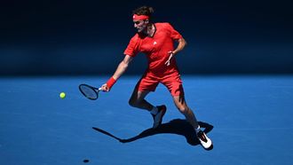 epa11821242 Stefanos Tsitsipas of Greece in action against Alex Michelsen of USA during his Men's Singles first round match at the Australian Open tennis tournament in Melbourne, Australia, 13 January 2025.  EPA/JAMES ROSS  AUSTRALIA AND NEW ZEALAND OUT