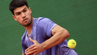 Spain's Carlos Alcaraz eyes the ball as he plays against Spain's Alejandro Davidovich Fokina during the Monte Carlo ATP Masters Series Tournament semi-final tennis match at the Monte Carlo Country Club in Roquebrune-Cap-Martin on April 12, 2025. 
Valery HACHE / AFP