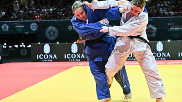 Netherlands' Marit Kamps competes against International Judo's Federation's Mariia Ivanova (blue) in the women's +78kg during the 2025 Judo World Championships at 'Papp Laszlo' Arena of Budapest, Hungary, on June 19, 2025. 
Attila KISBENEDEK / AFP