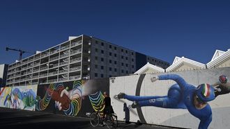 A local resident cycles past the Milano Cortina 2026 Olympic Village construction site, in Milan on July 31, 2025. The Winter Olympic Games Milano Cortina 2026 will take place from February 6 to 22 and the Winter Paralympic Games from March 6 to 22, 2026.
Stefano RELLANDINI / AFP