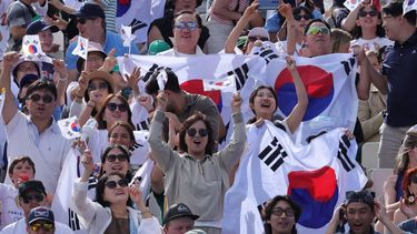 epa11503216 Supporters of South Korea celebrate during the Women Team Gold Medal match againsst China of the Archery competitions in the Paris 2024 Olympic Games, at the Invalides in Paris, France, 28 July 2024.  EPA/MARTIN DIVISEK