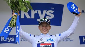 epa11476253 Belgian rider Remco Evenepoel of Soudal Quick-Step celebrates on the podium wearing the best young rider's white jersey following the end of the 14th stage of the 2024 Tour de France cycling race over 151km from Pau to Saint-Lary-Soulan Pla d'Adet, France, 13 July 2024.  EPA/GUILLAUME HORCAJUELO