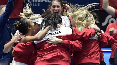 2023-11-11 22:41:04 Team Canada celebrate qualifying for the final after winning the semifinal doubles tennis match between Czech Republic and Canada on the day 5 of the Billie Jean King Cup Finals 2023 in La Cartuja stadium in Seville on November 11, 2023. 
CRISTINA QUICLER / AFP