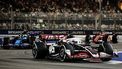 epa11619427 Danish driver Kevin Magnussen of Haas F1 Team (front R). French driver Pierre Gasly of Alpine F1 Team (L) in action during the Singapore Formula One Grand Prix at the Marina Bay Street Circuit, Singapore, 22 September 2024.  EPA/TOM WHITE