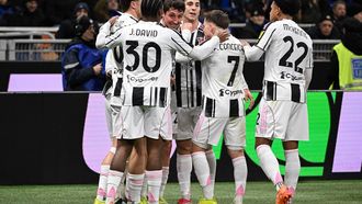 Juventus' Italian defender #27 Andrea Cambiaso (3L) celebrates after scoring Juventus' first goal during the Italian Serie A football match between Inter Milan and Juventus at the San Siro Stadium in Milan, on February 14, 2026. 
Piero CRUCIATTI / AFP