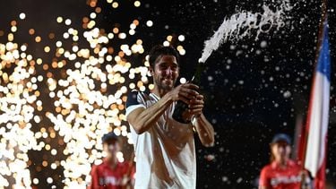 Argentina's Tomas Etcheverry celebrates with champagne after defeating Chile's Alejandro Tabilo during their men's singles final match at the Rio Open tennis tournament in Rio de Janeiro, Brazil, on February 22, 2026. 
MAURO PIMENTEL / AFP