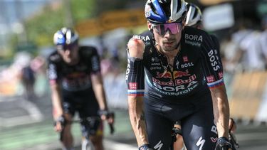 Red Bull - BORA - hansgrohe team's Slovenian rider Primoz Roglic, with visible injuries sustained in a crash in the final kilometers of the stage, cycles past the finish line of the 12th stage of the 111th edition of the Tour de France cycling race, 203,6 km between Aurillac and Villeneuve-sur-Lot, southwestern France, on July 11, 2024. 
Marco BERTORELLO / AFP