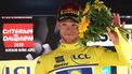 Lidl-Trek's Italian rider Jonathan Milan wearing the overall leader's yellow jersey celebrates on the podium of the 2nd stage of the 77th edition of the Criterium du Dauphine cycling race, 204,6 km between Prémilhat and Issoire, on June 9, 2025. 
Anne-Christine POUJOULAT / AFP