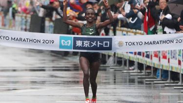 Ruti Aga of Ethiopia crosses the finish line to win the women's title at the Tokyo Marathon in Tokyo on March 3, 2019.  Ethiopia completed a double in the Tokyo Marathon March 3 as Birhanu Legese won the men's race and Ruti Aga took the women's title in unfavourable wet and windy conditions.
JIJI PRESS / AFP