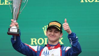 Second-placed Trident's Italian driver Leonardo Fornaroli celebrates on the podium after the Australia Formula 3 Grand Prix at the Albert Park Circuit in Melbourne on March 24, 2024. 
Martin KEEP / AFP