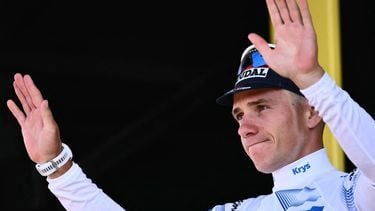 Soudal Quick-Step team's Belgian rider Remco Evenepoel celebrates on the podium with the best young rider's white jersey after the 13th stage of the 112th edition of the Tour de France cycling race, 10.9 km individual time trial between Loudenvielle and Peyragudes, in the Pyrenees mountains of southwestern France, on July 18, 2025. 
Marco BERTORELLO / AFP