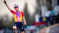 SD Worx's Dutch rider Demi Vollering celebrates as she cycles to the finish line to win the women elite race of the 'Dwars Door Vlaanderen' cycling race, 115 km starting and finishing in Waregem, on March 29, 2023. 
JASPER JACOBS / Belga / AFP