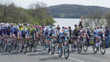 epa11258967 The peloton passes by the UllÃ­barri-Gamboa reservoir during the fourth stage of the Basque Country cycling tour, a 157.5km race from Etzarri Arantz to Legutio, Spain, 04 April 2024.  EPA/Adrian Ruiz Hierro