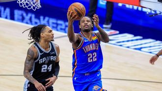 epa12985839 Oklahoma City Thunder guard Cason Wallace (R) makes a layup past San Antonio Spurs guard Devin Vassell (L) during Game 3 of the NBA Western Conference Finals between the San Antonio Spurs and the Oklahoma City Thunder in San Antonio, Texas, USA, 22 May 2026.  EPA/ADAM DAVIS SHUTTERSTOCK OUT