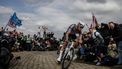 Alpecin-Deceuninck's Dutch rider Mathieu van der Poel cycles in a breakaway leading the race at the Carrefour de l'Arbre, a cobblestone road, during the 122nd edition of the Paris-Roubaix one-day classic cycling race, 259,2 km between Compiegne and Roubaix, northern France on April 13, 2025. 
JEFF PACHOUD / AFP