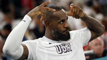 epa11531903 LeBron James of the US makes a crown gesture during the men's quarterfinal match between Brazil and USA in the Basketball competitions in the Paris 2024 Olympic Games, at the South Paris Arena in Paris, France, 06 August 2024.  EPA/CAROLINE BREHMAN