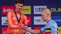 epa11606213 Silver medallist Olav Kooiij of the Netherlands (L) shakes hands with winner Tim Merlier of Belgium during the podium ceremony of the Men Elite Race of the UEC Road European Championships cycling race Limburg-Flanders, a 222.8 Km race from Heusden-Zolder to Hasselt in Hasselt, Belgium, 15 September 2024.  EPA/OLIVIER MATTHYS