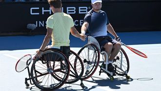 Sam Schroder (R) and Niels Vink (L) of the Netherlands react as they play against South Africa's Donald Ramphadi and Brazil's Ymanitu Silva during the men's wheelchair doubles final on day twelve of the Australian Open tennis tournament in Melbourne on January 27, 2023. 
Paul CROCK / AFP
