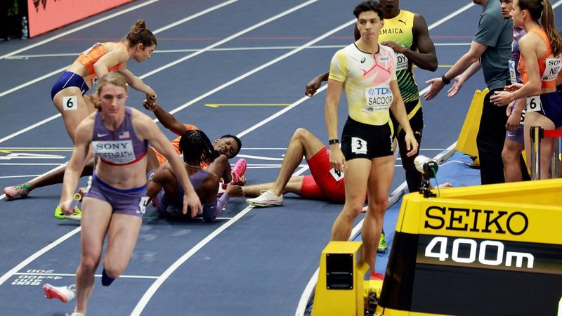 Netherlands' Keenan Blake is seen on the floor after a handover in the 4 x 400m relay final during the World Athletics Indoor Championships Kujawy Pomorze 2026 in Torun, Poland on March 21, 2026. 
Wojtek RADWANSKI / AFP
